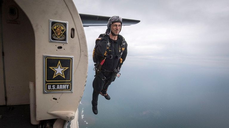 A Golden Knights parachuter jumps from a plane at Jones...