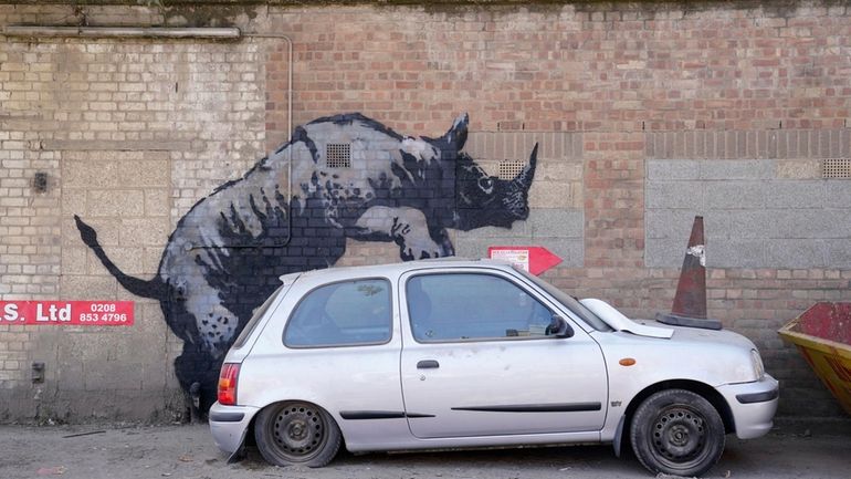 A new artwork unveiled by Banksy, depicting a rhinoceros which...