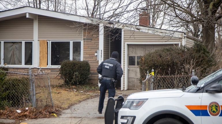 Nassau police investigate on Feb. 3 near where the body of...