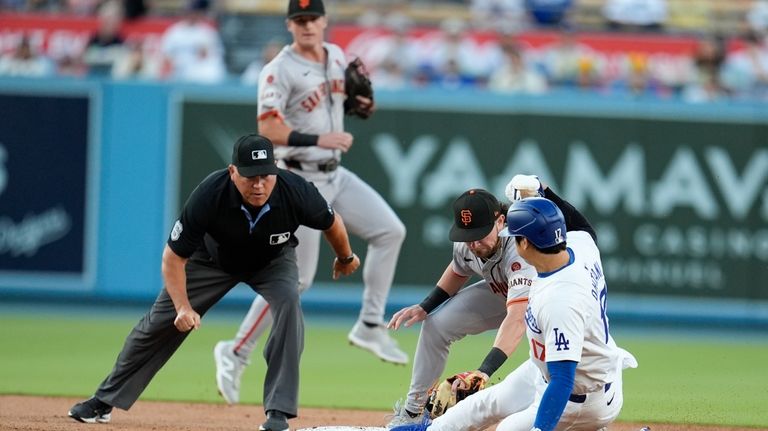 San Francisco Giants second baseman Brett Wisely, second from right,...