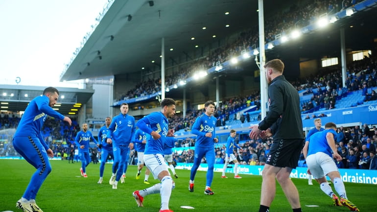 Everton players warm up before the English Premier League soccer...