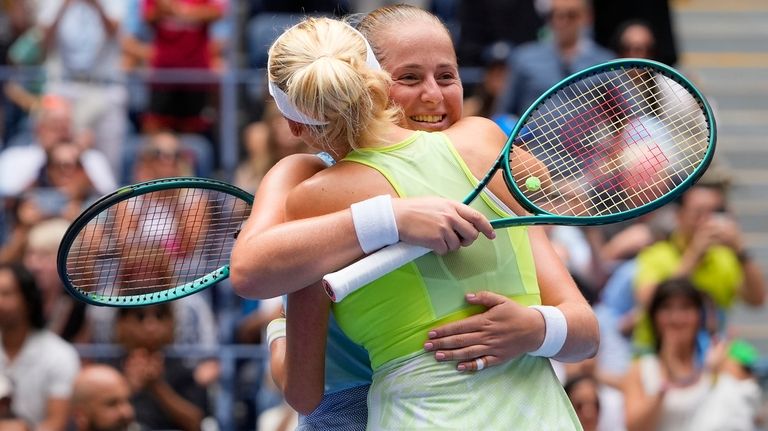 Jelena Ostapenko, of Latvia, right, hugs Lyudmyla KIchenok, of Ukraine,...