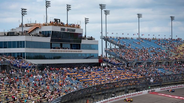 Scott McLaughlin, left, leads during an IndyCar auto race, Sunday,...