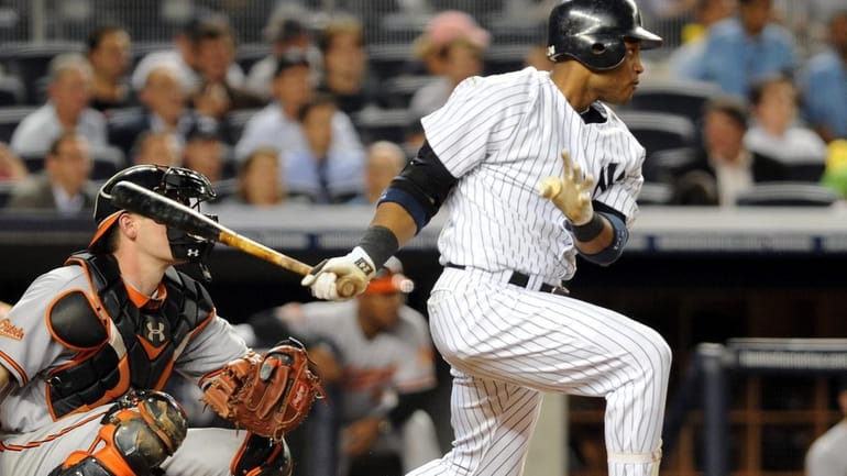 New York Yankees' Robinson Cano (24) singles in the sixth...