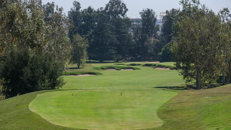 The tee box of the 11th hole is viewed during...