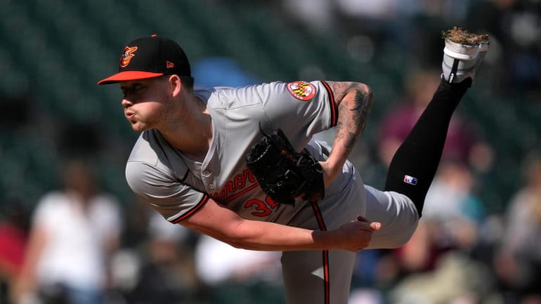 Baltimore Orioles starting pitcher Kyle Bradish follows through during the...