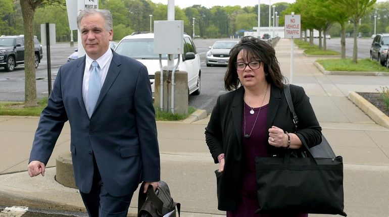 Edward and Linda Mangano arrive at federal court in Central...