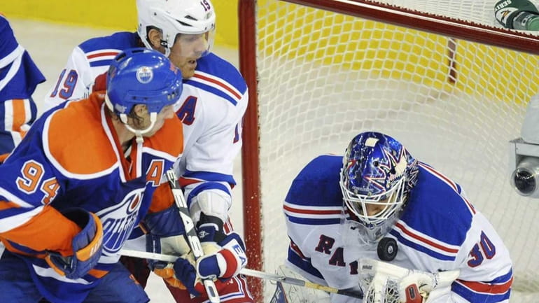 New York Rangers' Brad Richards defends as Edmonton Oilers' Ryan...