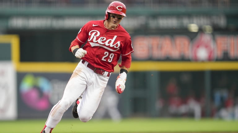 Cincinnati Reds' Stuart Fairchild (17) celebrates with first base