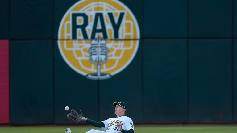 Oakland Athletics center fielder JJ Bleday catches a fly out...