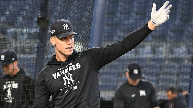 New York Yankees' Aaron Judge walks out of the batting...