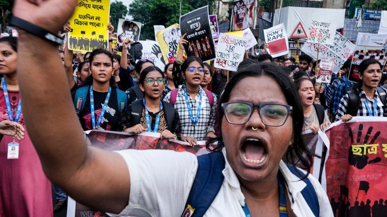 Engineers and engineering students attend a protest against the rape...