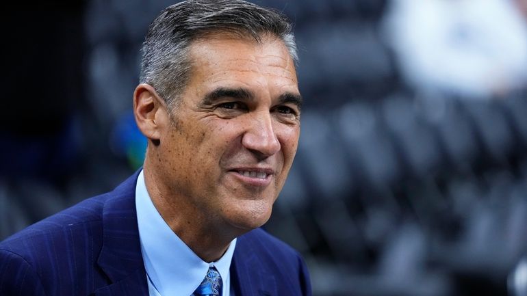 FILE - Former Villanova head coach Jay Wright smiles before...