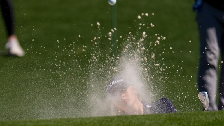 Gianna Clemente hits from the sand trap on the second...