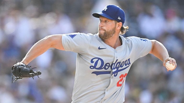 Los Angeles Dodgers starting pitcher Clayton Kershaw (22) delivers during...