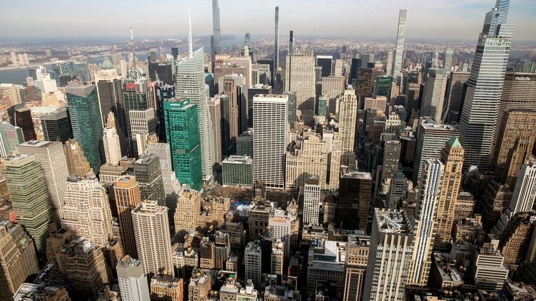 The Manhattan skyline is seen from the observatory of the Empire State...