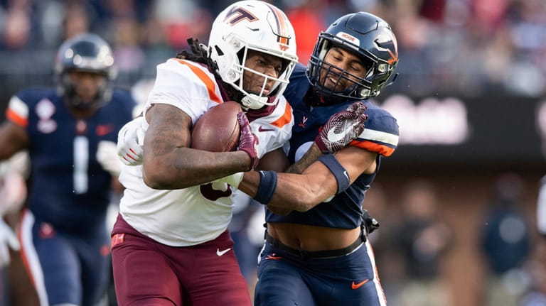 Virginia Tech tight end Dae'Quan Wright (8) is tackled by...