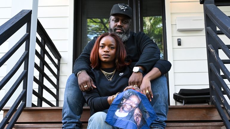 Reggie Cunningham, top, and his wife Ferguson activist Brittany Packnett-Cunningham...