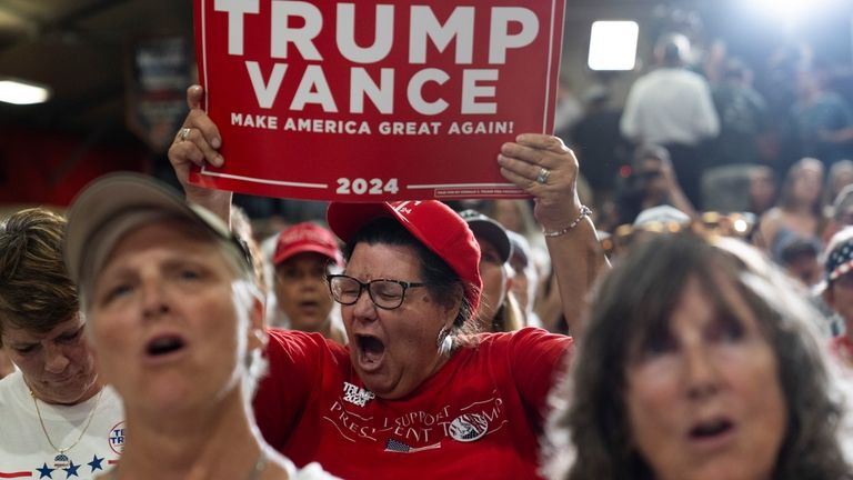 A supporter reacts while listening to Republican vice presidential candidate...