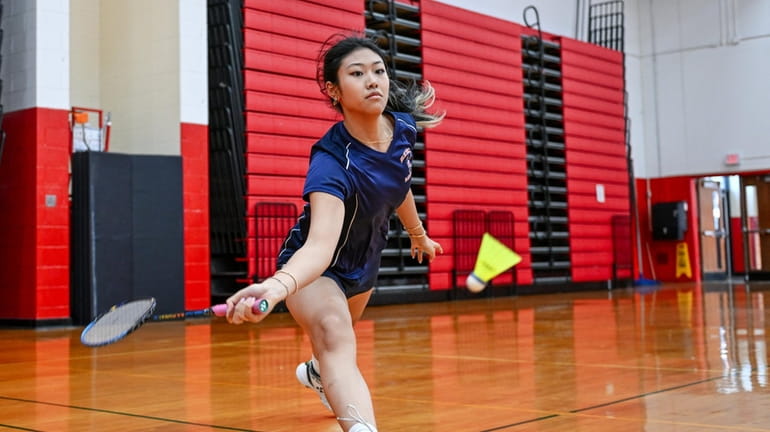 Kayla Wu of Great Neck South stretches for the return...