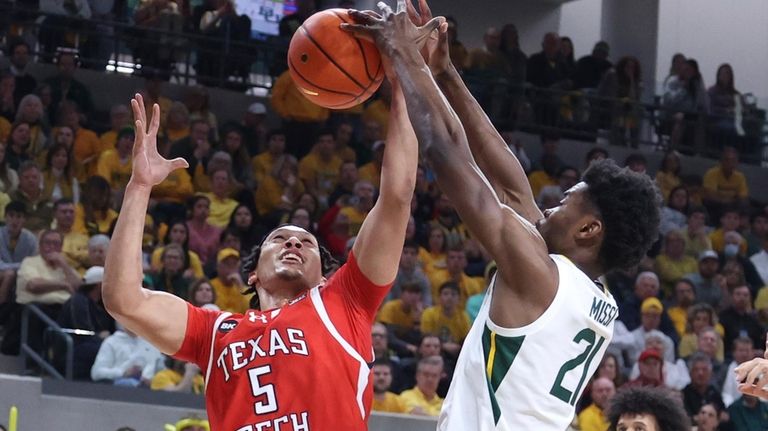 Texas Tech guard Darrion Williams is fouled by Baylor center...