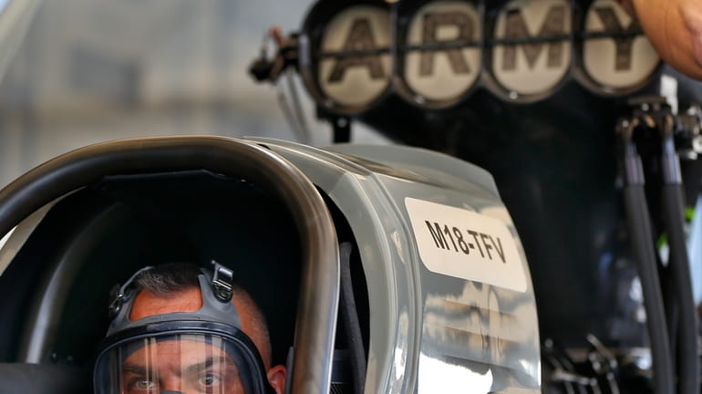 Tony Schumacher stares out from the seat of his Top...