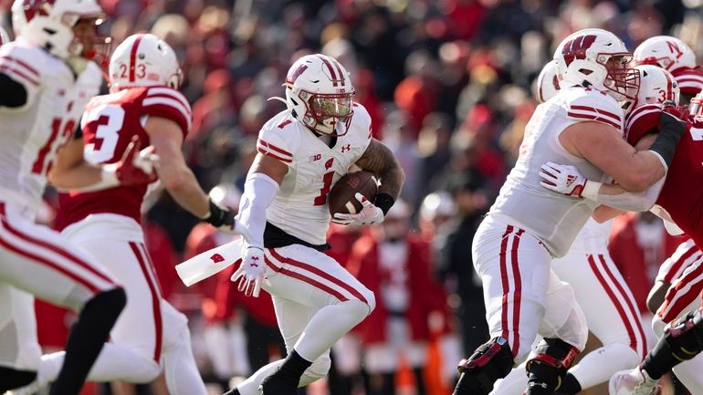 Wisconsin's Chez Mellusi carries the ball against Nebraska during the...