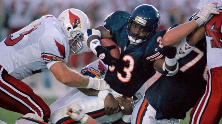 Chicago Bears running back Darren Lewis (33) falls to the...