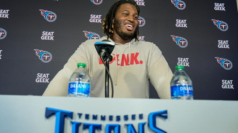 Tennessee Titans tackle JC Latham responds to questions during a...