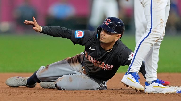 Cleveland Guardians' Andres Gimenez looks for the call after being...