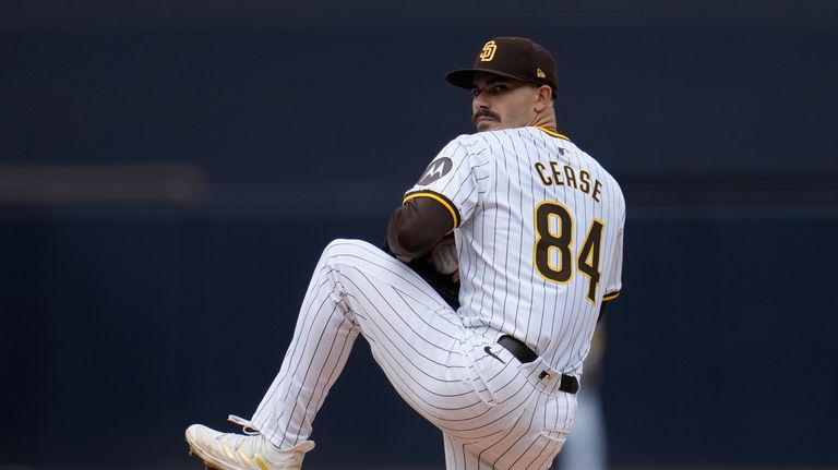 San Diego Padres starting pitcher Dylan Cease works against a...