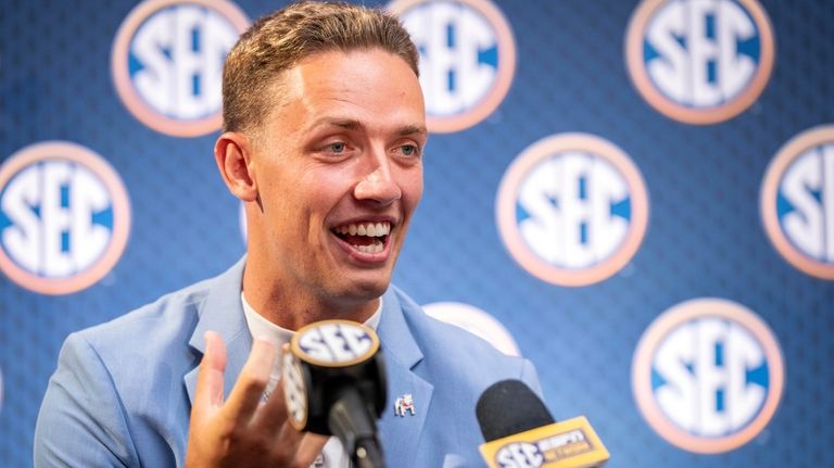 Georgia quarterback Carson Beck speaks during Southeastern Conference NCAA college...