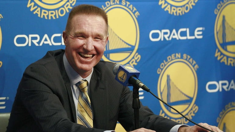 Former Golden State Warriors player Chris Mullin laughs while speaking...