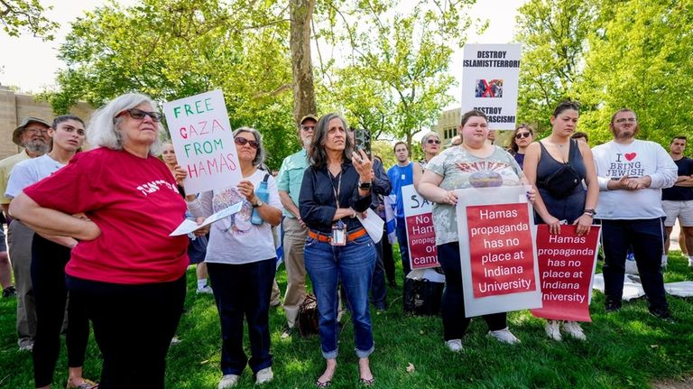 Protesters listen during a pro-Israel rally at Indiana University in...