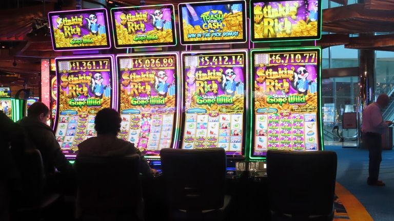 Gamblers play slot machines at the Ocean Casino Resort in...