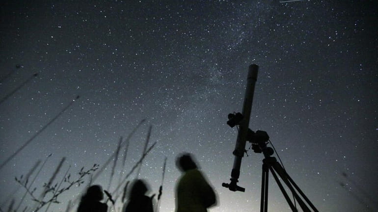 Astronomers observe the night sky for the Perseid meteor shower...