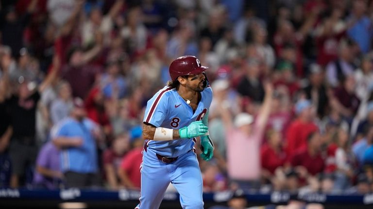 Philadelphia Phillies' Nick Castellanos watches after hitting a two-run home...