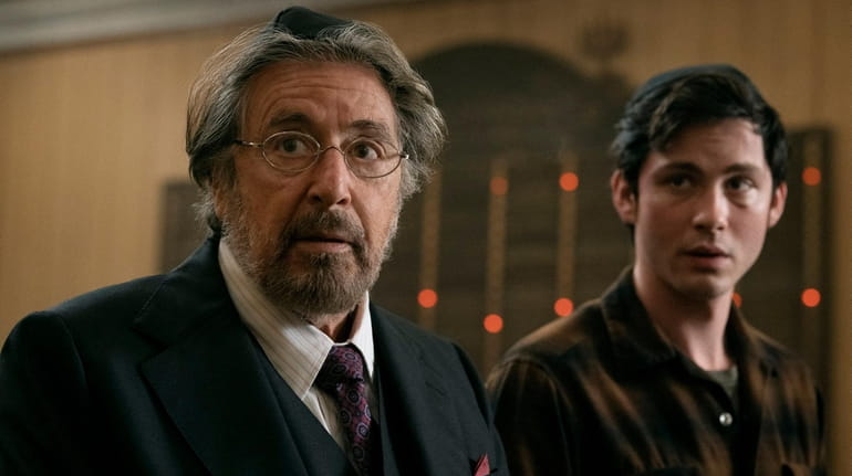 Al Pacino (left) as Meyer Offerman and Logan Lerman as...