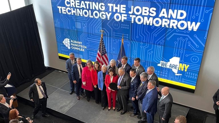 New York Gov. Hochul and Sen. Chuck Schumer pose for...