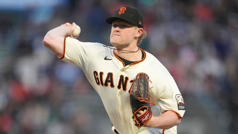 San Francisco Giants pitcher Logan Webb works against the San...