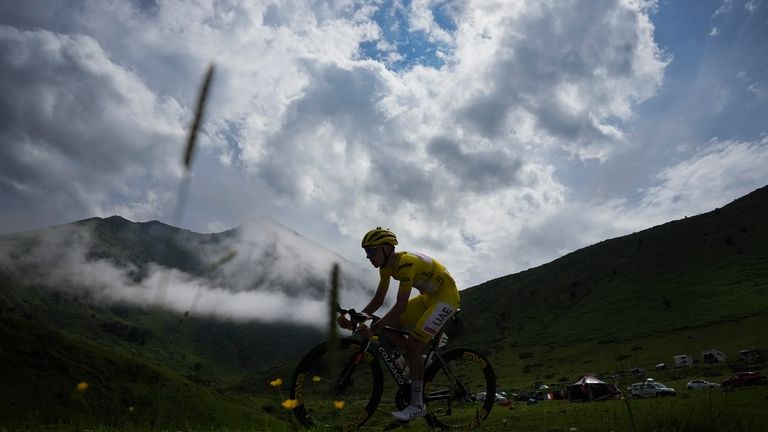 Stage winner Slovenia's Tadej Pogacar, wearing the overall leader's yellow...