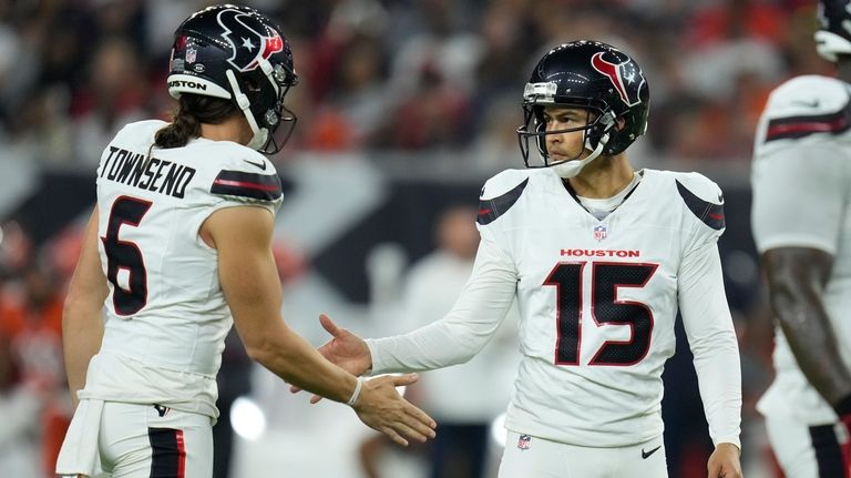 Houston Texans kicker Ka'imi Fairbairn (15) is congratulated by teammate...