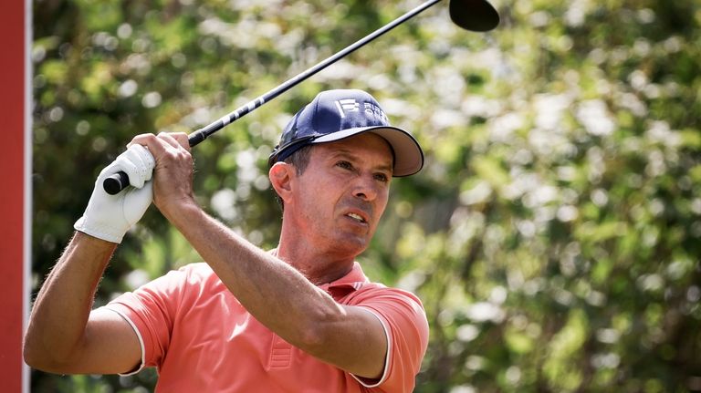 Canada's Mike Weir hits a tee shot on the second...