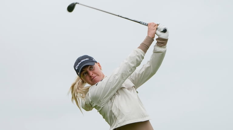 Charley Hull, of England, hits off the ninth tee during...