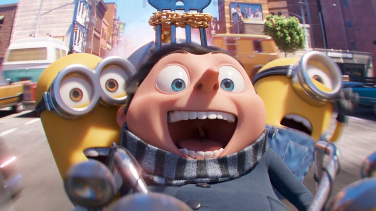 Minions Kevin, left, and Stuart flank Gru, voiced by Steve...