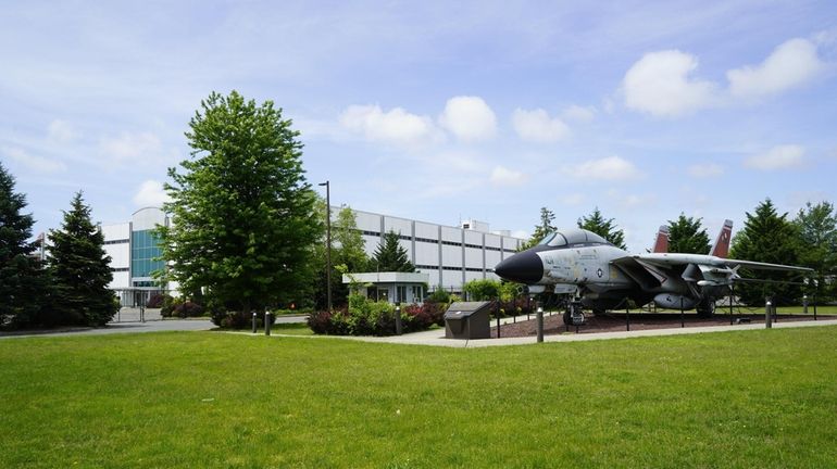 The Navy F-14 Tomcat fighter jet on display outside the former Grumman...