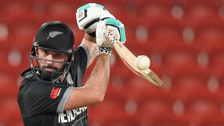 New Zealand's Daryl Mitchell plays a shot during the ICC...