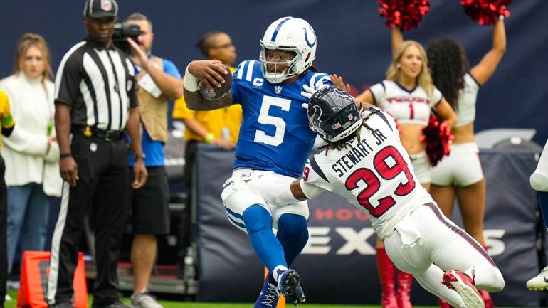 Indianapolis Colts quarterback Anthony Richardson (5) is hit by Houston...