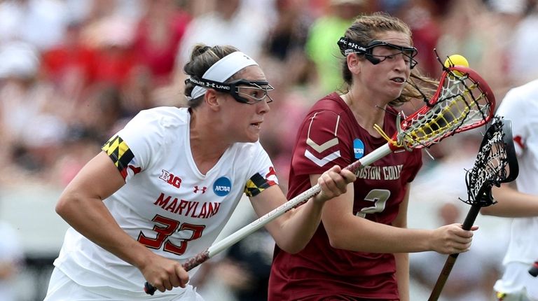 Erica Evans #33 of Maryland Terrapins and Sam Apuzzo #2...