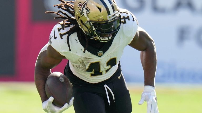 New Orleans Saints running back Alvin Kamara (41) is tackled...